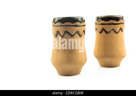 Set of clay shot glass, bowl, old dishes, antiques on white isolated background Stock Photo