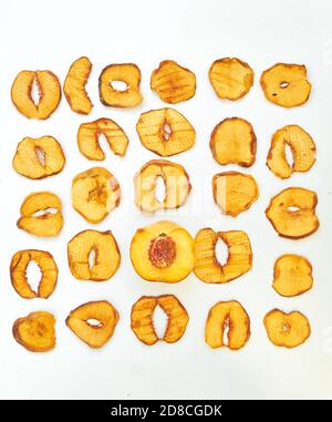 Fresh peach and dried peach slices on white background. Stock Photo