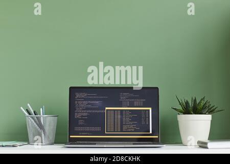 Image of laptop with software on the screen at workplace at office Stock Photo