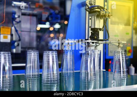 Clear Plastic glass transfer on Automated conveyor systems industrial automation for package Stock Photo
