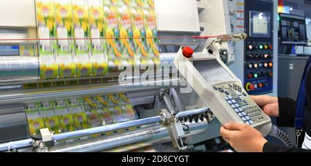 Engineer check and control automation packing machine unit of high technology food packing machine for industrial Stock Photo
