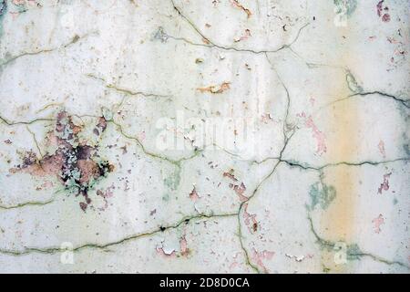 Background of old cracked weathered green paint on cement wall. Stock Photo