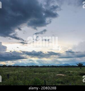 Chasing sunsets in Valledupar right before a storm hits. This is on the southern side of the airport where there are lots of empty fields. Stock Photo