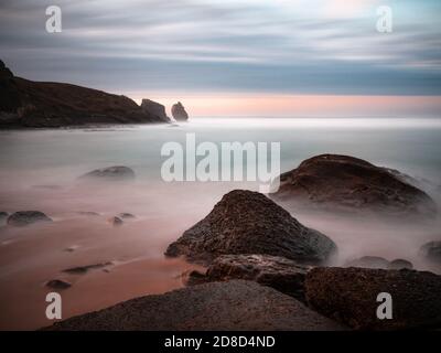 Beautiful sunset on Robayera beach in Miengo, Cantabria. Long exposure seascape in northern Spain. Stock Photo