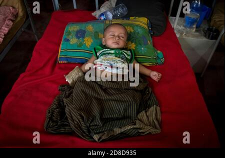 Rohingya refugee is seen at hospital at Kutupalong camp on January 17, 2018 in Cox's Bazar, Bangladesh. In November 2017 there were 7 named camps in Kutupalong, now there are 20 and there are now approximately 600,000 Rohingya refugees in the Kutupalong refugee camp of Southern Bangladesh. While preparations are now being made for the Monsoon season which is fast approaching. Stock Photo