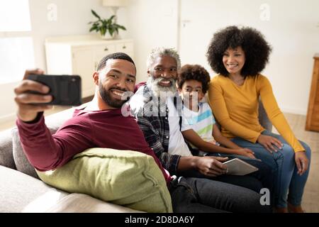 Multi generation family taking a selfie at home Stock Photo