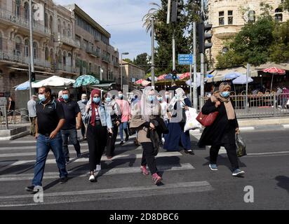 Jerusalem, Israel. 29th Oct, 2020. Palestinian Muslims wear protective masks as they walk to the Old City of Jerusalem to celebrate the birthday of the Prophet Muhammad on Thursday, October 29, 2020. Photo by Debbie Hill/UPI Credit: UPI/Alamy Live News