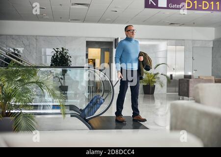 Calm Caucasian male tourist with his baggage Stock Photo