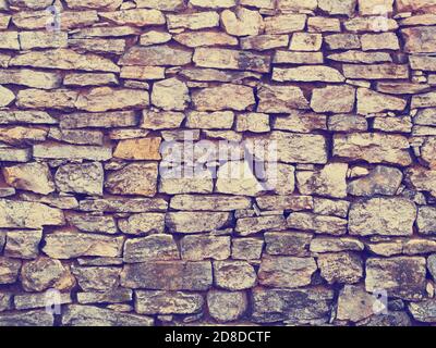 Old brick stone wall background, instagram style Stock Photo