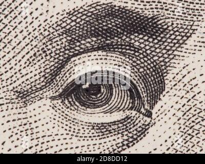 Founding father Benjamin Franklin eye super macro on us one hundred dollar bill, united states money closeup Stock Photo