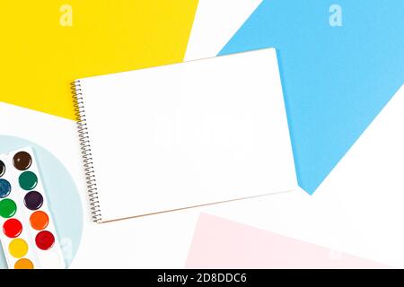 Learning, hobby, art background. Empty sketchbook with art supplies around. Mockup. Top view, flat lay Stock Photo