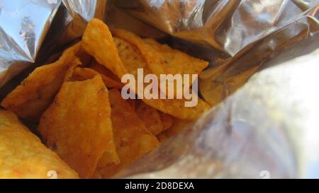 Close up, top view of a potato chips in a opened package Stock Photo