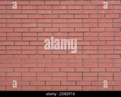 Modern artificial smooth red brick wall surface background Stock Photo