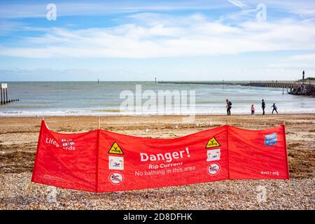 Life Guard wind break with danger warning sign on the beach at Littlehampton, West Sussex, England Stock Photo