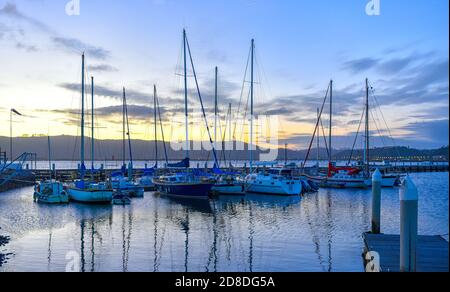 Private Boats at sunset in the Knysna Lagoon, Garden Route, South Africa Stock Photo