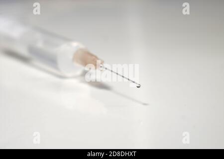 injection with corona, COVID-19 vaccine, extreme close up, free copy space Stock Photo