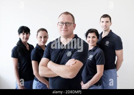 Dental Practice, doctor and his team, portrait.Teamwork Stock Photo