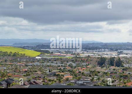 AUCKLAND, NEW ZEALAND - Aug 31, 2019: Aerial view of East Tamaki Heights suburban houses with hills on the horizon Stock Photo