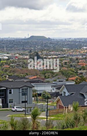 AUCKLAND, NEW ZEALAND - Aug 31, 2019: Aerial view of East Tamaki Heights suburban houses with hills on the horizon Stock Photo