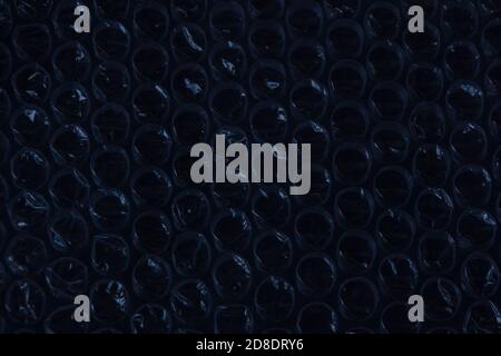 dark blue sparkling bubbles, brilliant plastic cellophane bubblewrap drops texture Stock Photo