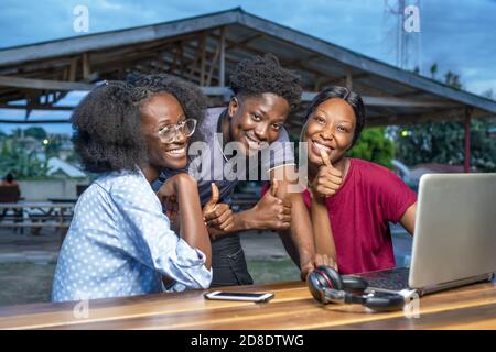 African friends working together on their laptop outdoors - teamwork concept Stock Photo