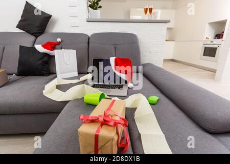 Messy living room interior with Christmas tree. Chaos after party Stock Photo