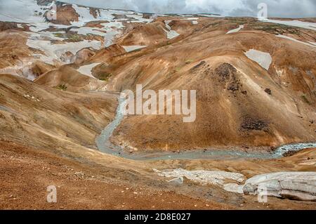 Iceland is a land of ice and fire. In the geothermal area Kerlingarfjoll one can see smoke and boiling fumaroles from the geothermal field as well as Stock Photo