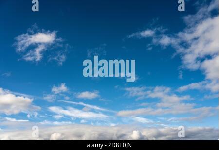 Alto cumulus clouds in deep blue sky Stock Photo