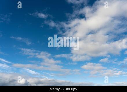Alto cumulus clouds in deep blue sky Stock Photo