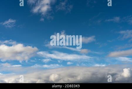 Alto cumulus clouds in deep blue sky Stock Photo