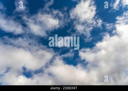 Alto cumulus clouds in deep blue sky Stock Photo