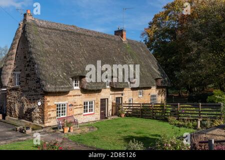 Pair of thatched cottages in the village of Cranford St John near Kettering, UK Stock Photo