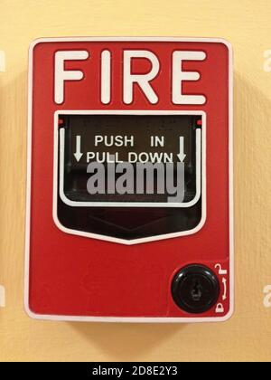 Manual pull station on wall for fire alarm system Stock Photo