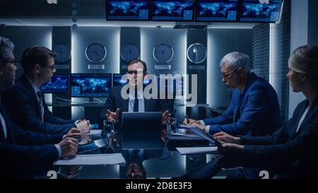 Government Officials, Business Executives Watching Presentation in the Conference Room. Working Projector on the Table. Business People Having Stock Photo