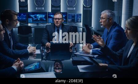 Government Officials, Business Executives Watching Presentation in the Conference Room. Working Projector on the Table. Business People Having Stock Photo