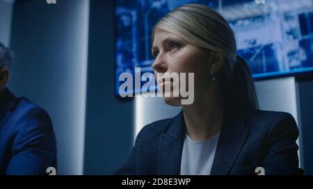 Portrait of the Strong Minded Female Government Agency Official Speaking on a Meeting. Serious Business People Negotiating. Stock Photo