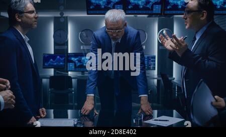 Team of Politicians, Government Officials, Corporate Business Leaders Have Heated Debate while Standing at the Negotiating Table in the Conference Stock Photo