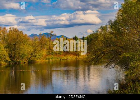 Missisquoi river in autumn with Jay Peak in the distance in Vermont Stock Photo