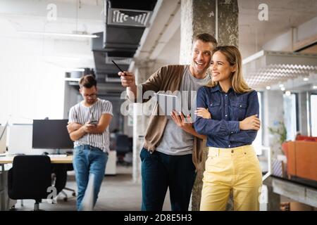 Company employees working in software development and designer office Stock Photo