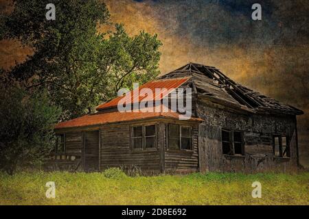 Abandoned farm house ruin with rusted metal roof and broken, empty windows. Found in the countryside of the Texas Hill Country. Stock Photo