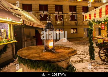 Street lantern in Christmas market in night Riga, Latvia, East Europe. Stock Photo