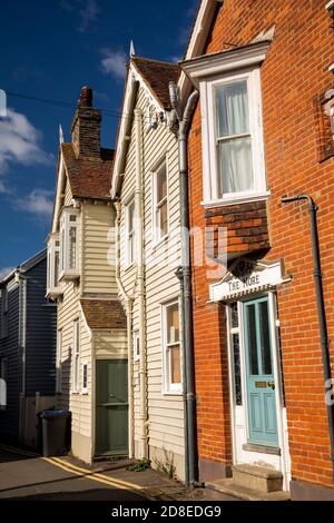 UK, Kent, Whitstable, Sea Wall, brick and weatherboarded houses Stock Photo