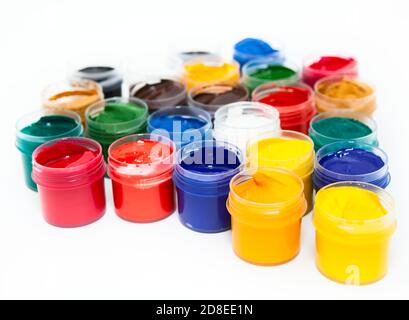 Colorful paints in plastic boxes for drawing, a white background Stock Photo