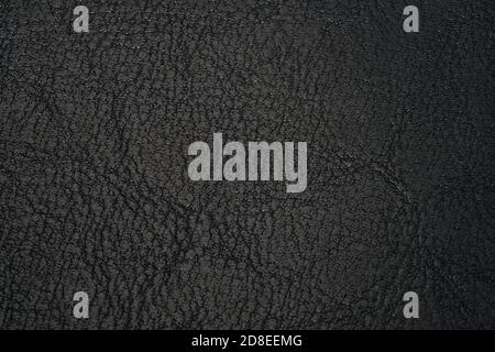 leather texture black background. texture of genuine leather. Backdrop background texture effect for design. Artificial eco leather close up. Stock Photo