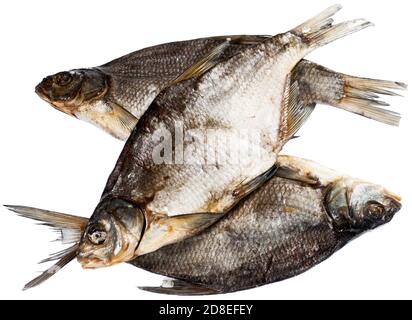 Three dried and solt bream fishes, isolated on a white background Stock Photo