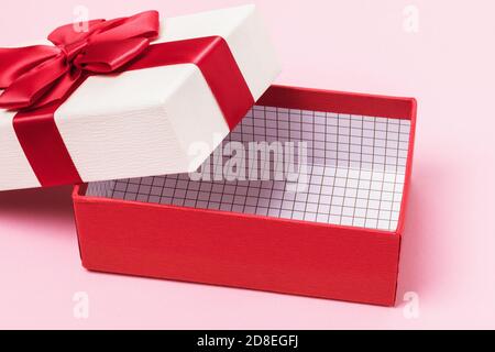 Empty gift box on a pink background close-up Stock Photo