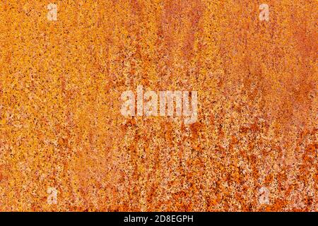Close up detail of orange and brown rust on a metal sheet Stock Photo