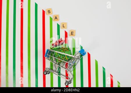 Word SALE with shopping cart on color background Stock Photo