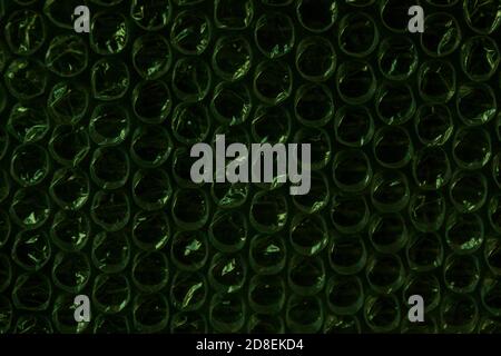 forest green sparkling bubbles, brilliant plastic cellophane drops texture eco-protection background Stock Photo