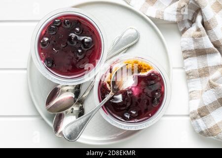 Sweet desssert. Cheesecake cup on plate. Top view. Stock Photo